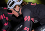 Cyclist in black and pink cycling gear with Kask helmet